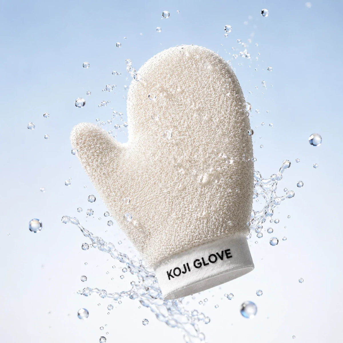 Peeling-Handschuh Kōji Glove mit spritzendem Wasser