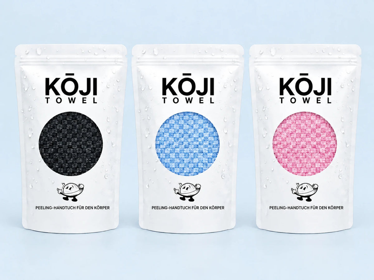Die drei Farben des Kōji Peeling-Handtuchs: Schwarz, Blau und Rosa.