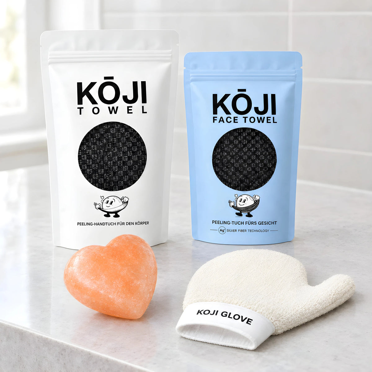 Die vier Produkte des Kōji Sets nebeneinander auf einer steinernen Badablage.